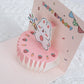 Colorful 3D pop-up cake birthday card with bunny pink design, great for kids' birthdays or special occasions